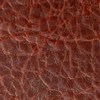 A close-up image of a Rogue Industries American Bison leather checkbook cover texture.