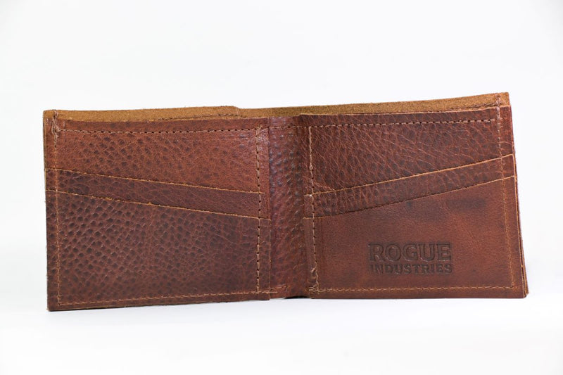 A brown genuine cowhide leather Heritage Wallet by Rogue Industries with a logo on it, made in USA.