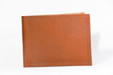 A genuine cowhide leather Heritage Wallet with stitching, made in USA by Rogue Industries.