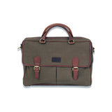 A green waxed canvas laptop bag from Rogue Industries with brown leather straps.
