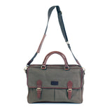 A durable green waxed canvas laptop bag with brown leather straps by Rogue Industries.