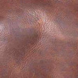 A close-up image of Rogue Industries' Seal Cove Leather Duffle Bag's imported brown top grain cowhide texture.