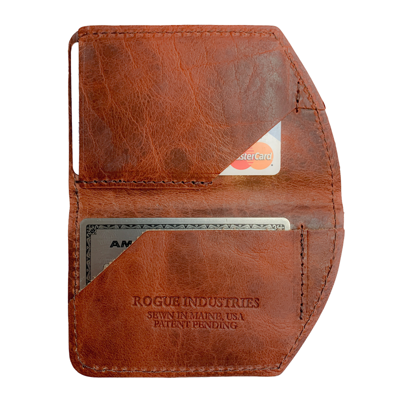 A brown, slim leather Rogue Industries Minimalist Wallet with a credit card in it.