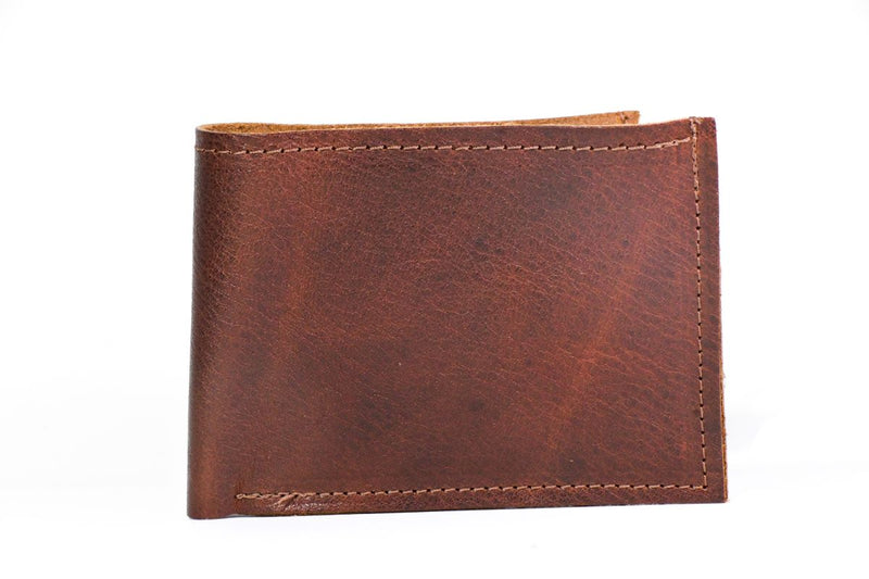 A genuine cowhide leather Heritage Wallet with stitching, made in USA by Rogue Industries.