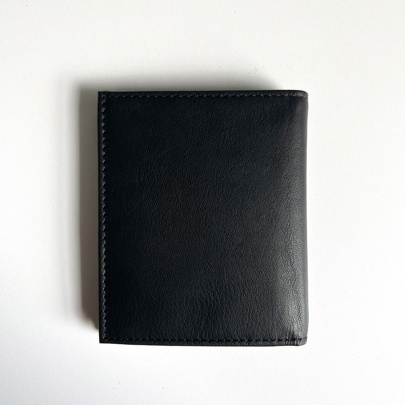 A Rogue Industries Leather Badge Holder Wallet on a white surface.