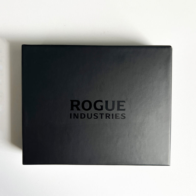 A premium Leather Badge Holder Wallet in black with the words Rogue Industries on it, designed for first responders.