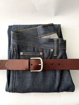 A pair of jeans with a handmade Rogue Industries Baxter Leather Belt - 1.5" Wide.