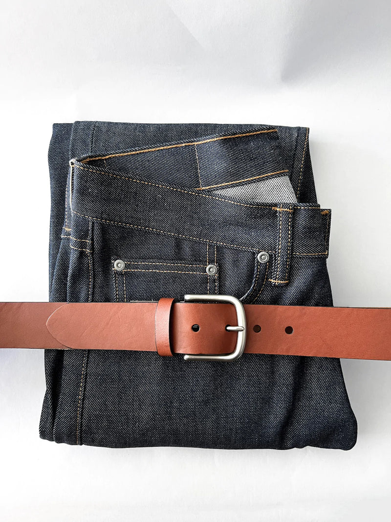 A pair of jeans with a brown Baxter Belt and Made in Maine Rogue Wallet Bundle by Rogue Industries.