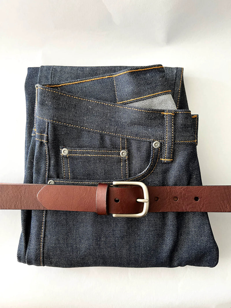 A pair of jeans with a Rogue Industries Chamberlain Belt and Minimalist Wallet Bundle.
