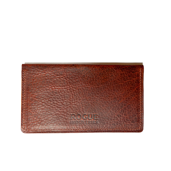 A brown American Bison leather checkbook cover with the word "focus" on it, crafted in a Maine workshop by Rogue Industries.
