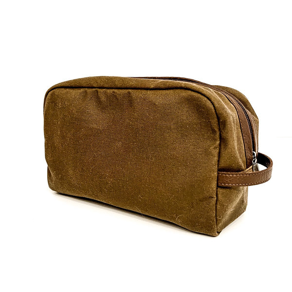 A durable Rogue Industries Waxed Canvas Dopp Kit on a white background.