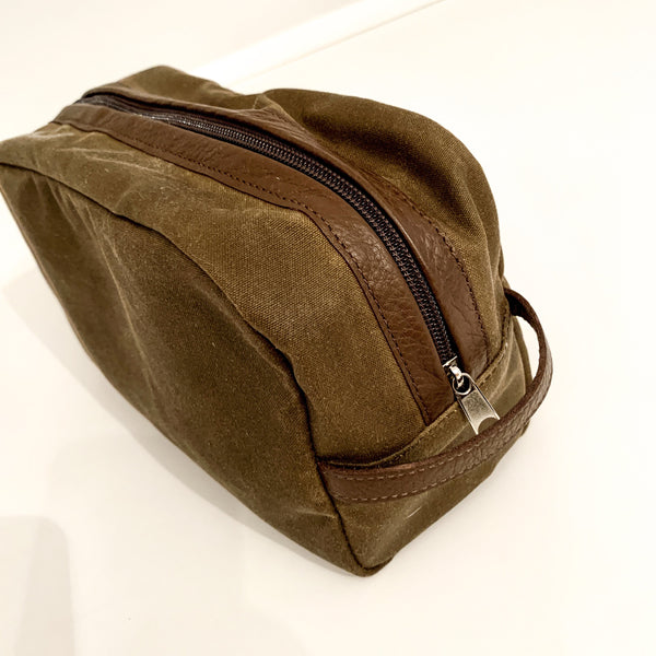 A durable brown and tan Rogue Industries Waxed Canvas Dopp kit on a white surface, made in USA.