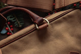 A durable Waxed Canvas Laptop Bag with a brown strap by Rogue Industries.