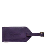 A purple Rogue leather luggage tag with the word trotter, Made in Maine.