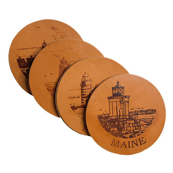 A set of Maine Lighthouse Coaster Set with a Rogue Industries lighthouse on them.