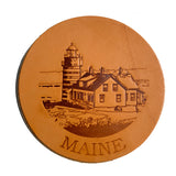 A Maine Lighthouse Coaster Set with an image of a lighthouse in Maine by Rogue Industries.