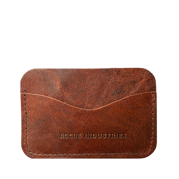 A brown Rogue Industries moose leather card case with the words made industries on it.