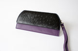 A black and purple leather RFID Blocking Clutch - Ostrich Print by Rogue Industries.
