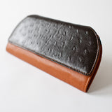 A brown and black Rogue Industries RFID Blocking Clutch - Ostrich Print.