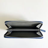 A blue zippered Leather Smartphone Clutch made of premium leather by Rogue Industries on a white surface.