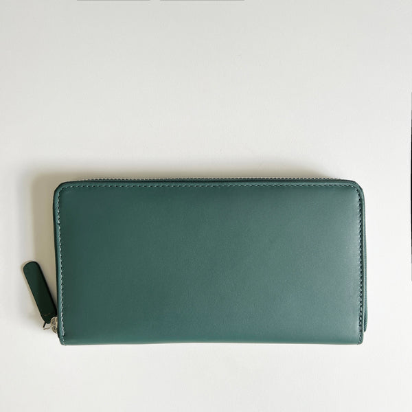 A green, premium leather Rogue Industries Leather Smartphone Clutch on a white surface.