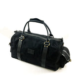 A water-resistant White Cap Waxed Canvas Duffle bag with a handle by Rogue Industries.