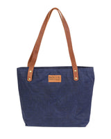 A durable Allagash River Tote Bag with brown leather handles by Rogue Industries.