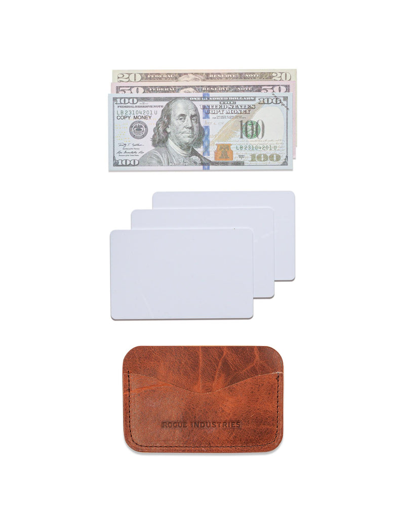 A Maine crafted Rogue Industries brown American Bison leather Bison Card Case with a dollar bill and a credit card.