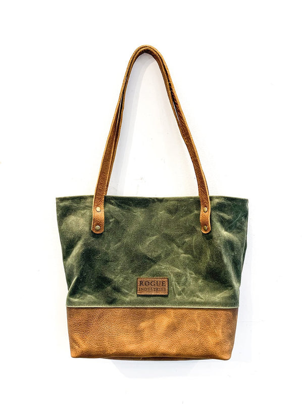 A green and tan waxed canvas and leather Saco River tote bag by Rogue Industries.