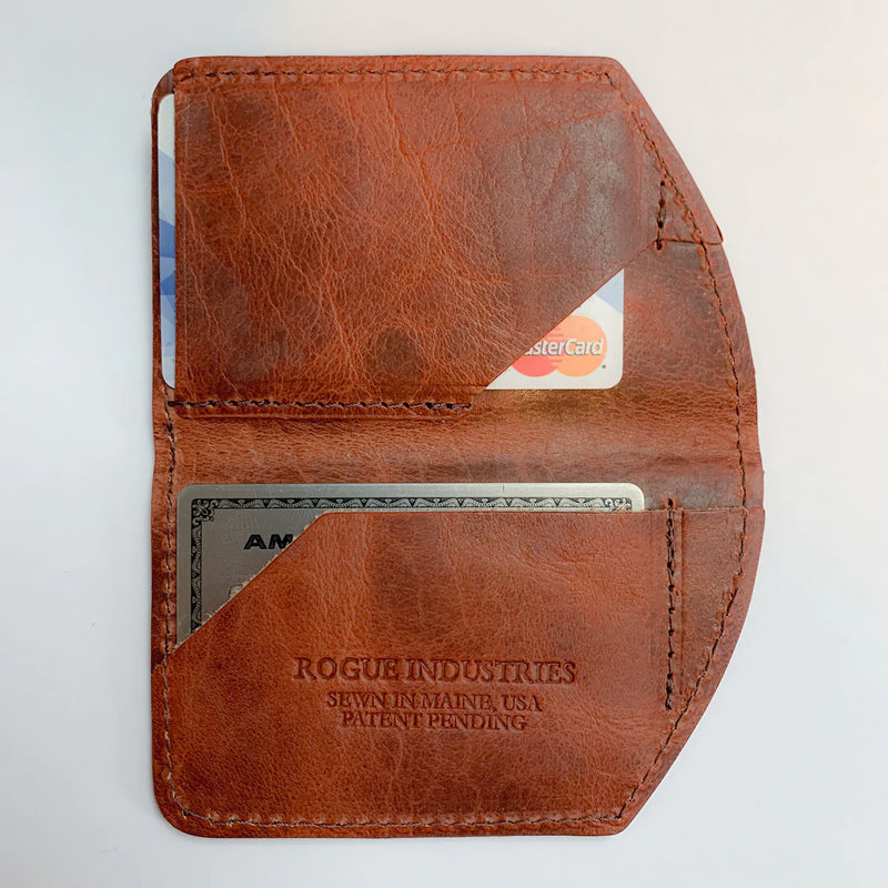 A minimalist brown leather Chamberlain Belt and Minimalist Wallet Bundle with a credit card inside by Rogue Industries.