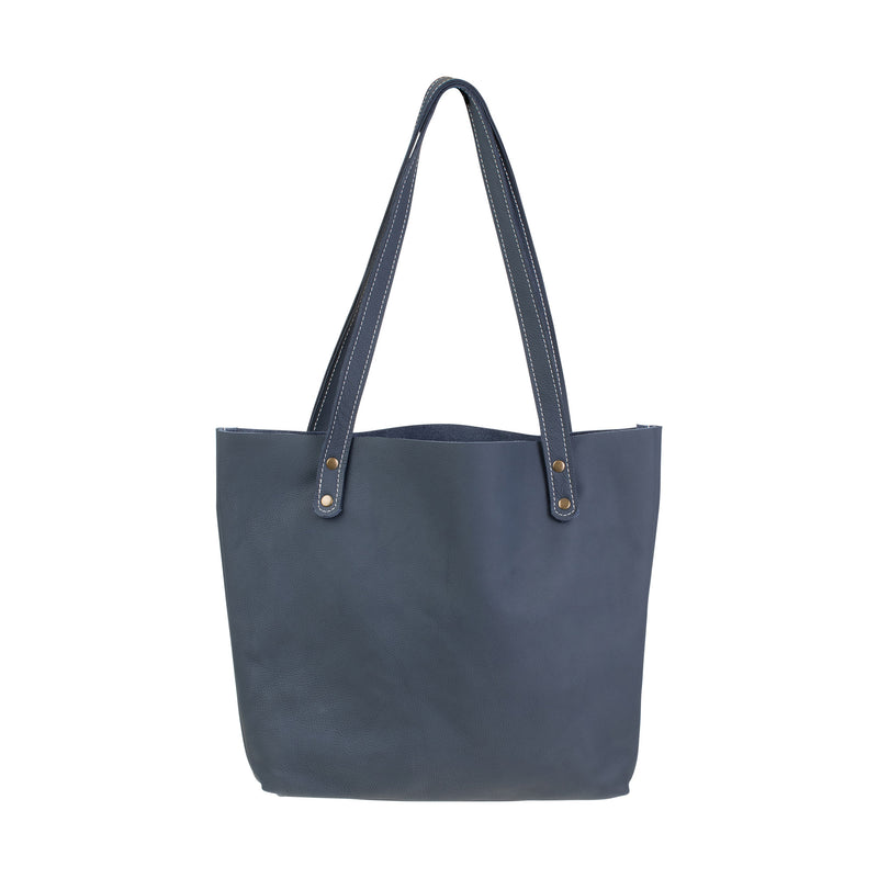 A blue Fore Street Tote Bag made of full-grain leather with a handle by Rogue Industries.