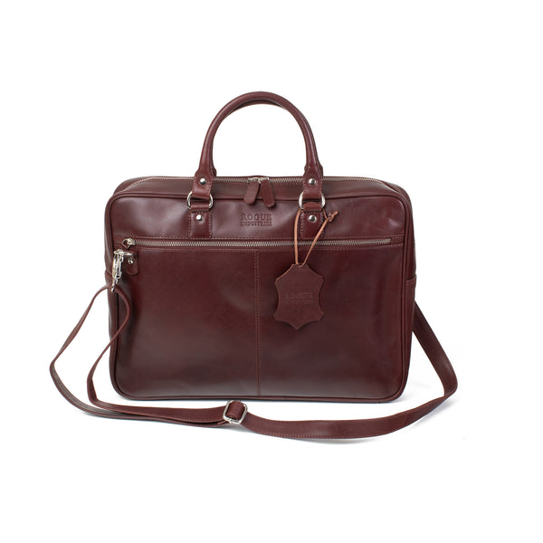A brown genuine leather West End Slim Leather Laptop Bag by Rogue Industries with a removable strap.