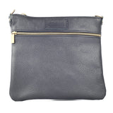 A Rogue Factory Seconds - Ellis River Crossbody Bag in Leather by Rogue Industries with a top zipper and a front zipper pocket, featuring gold-toned hardware, an adjustable strap, and a small brand logo embossed near the top.
