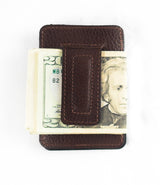 A front pocket Rogue Money Clip from Rogue Industries, crafted from genuine top-grain leather, designed to hold a stack of U.S. twenty-dollar bills.