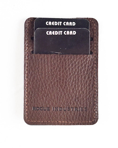 The Rogue Money Clip by Rogue Industries, made from genuine top-grain brown leather, easily fits in your front pocket. It securely holds two black credit cards and conveniently functions as a money clip wallet.