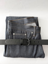 A pair of jeans with a Rogue Industries Chamberlain Leather Belt - 1.25" Wide.