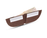 A brown Rogue Industries Nantucket Front Pocket Wallet in Moose Leather with money in it.